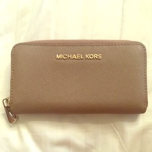 Michael Kors zip closure wallet.